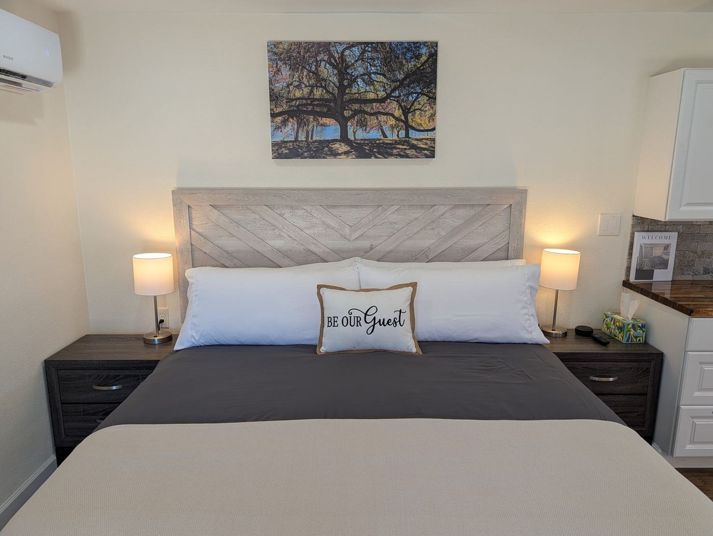 Bed with 'Be our guest' pillow